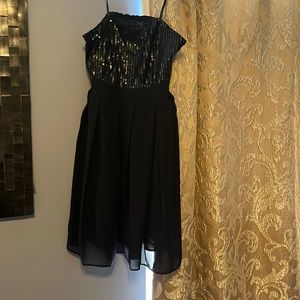 Strapless black dress with built in support.  Has never been worn!